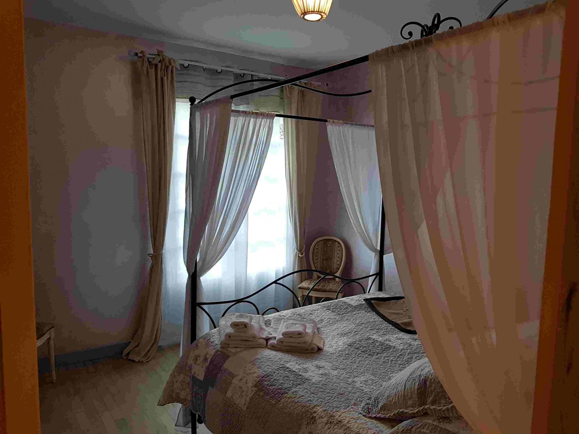 Bedroom with four-poster bed